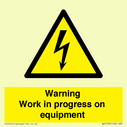 warning-work-in-progress-on-equipmentwith-electrical-hazard-symbol~
